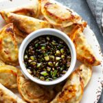 SHEET PAN SPICY CHICKEN POTSTICKERS WITH GINGER SAUCE