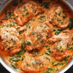 SKILLET CHICKEN THIGHS WITH CREAMY TOMATO BASIL SPINACH SAUCE